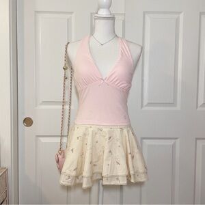 Pink halter top with lace detailing and ribbon